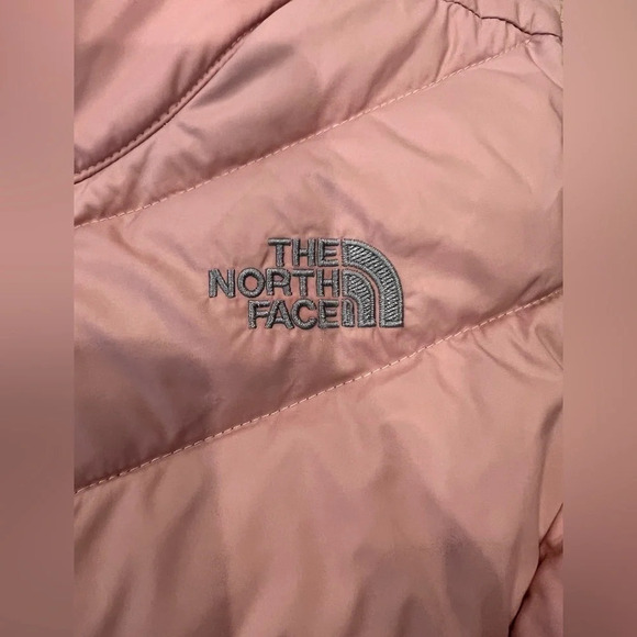 The north face 
Pink puffer vest 
Pilling on inside, Small stains on front - Picture 3 of 9